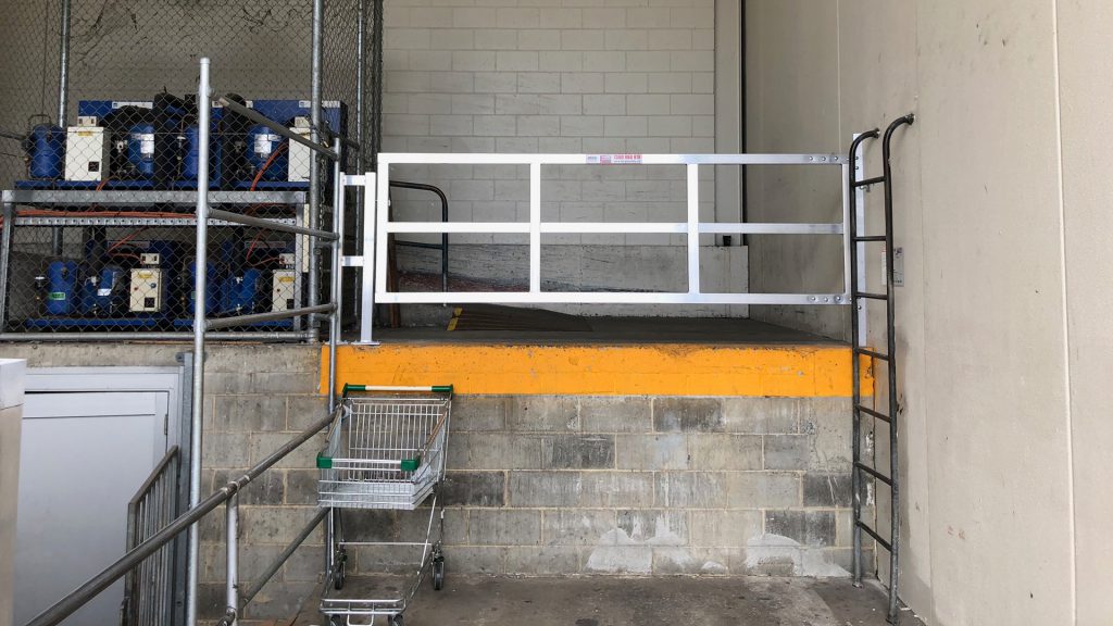 Fall protection gate in a loading dock installed to mitigate the risk of a fall in that area.