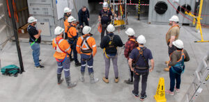 Trainer and participants preparing to undertake work at heights exercises.