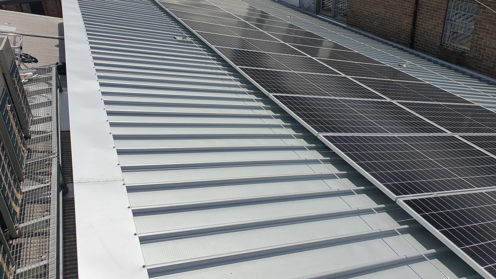 Static line fall protection system to allow contractors to access solar panels for maintenance.