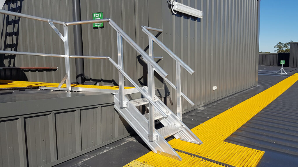 FRP walkway leading to aluminium steps up to a platform.
