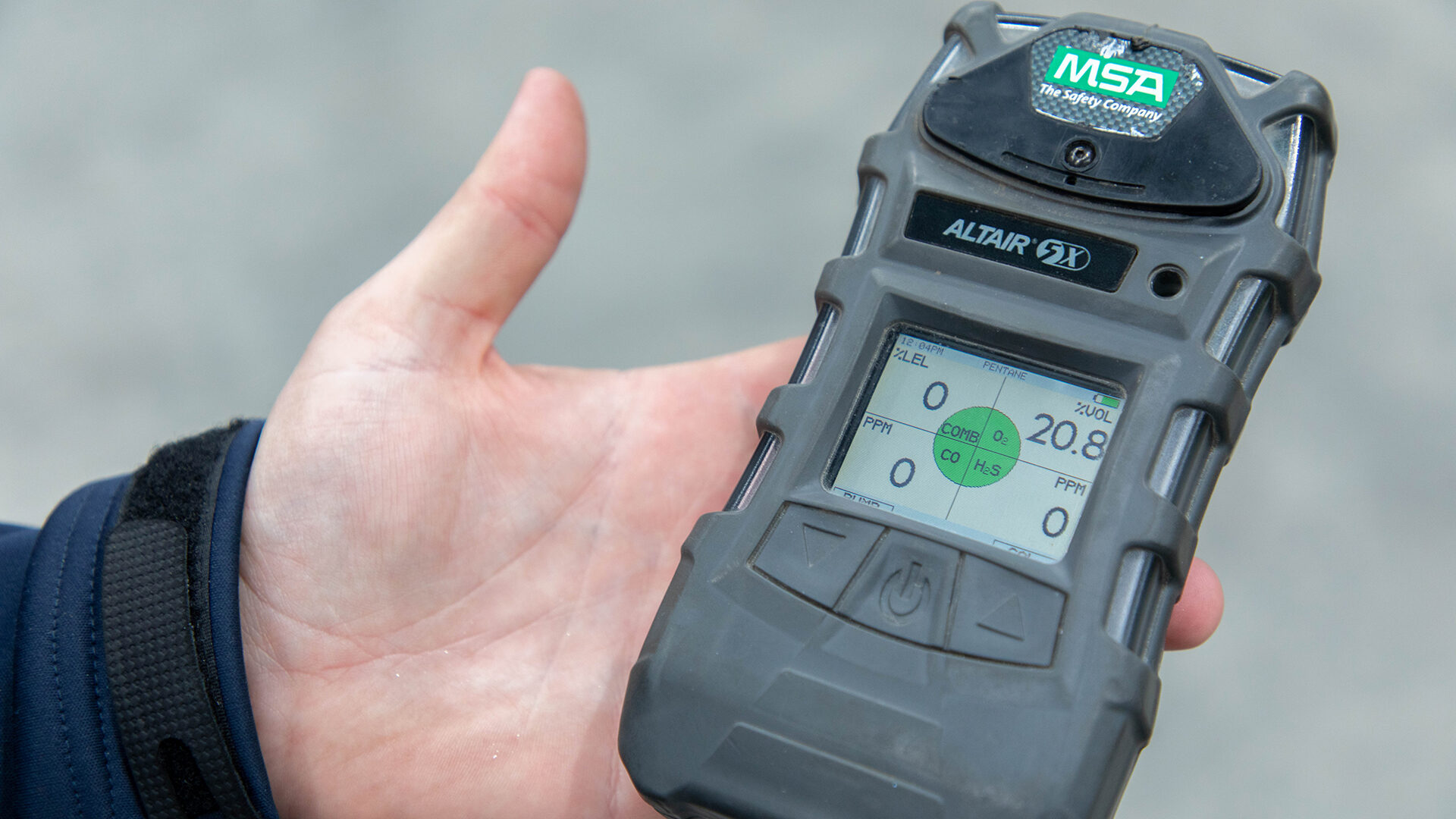 Worker holding an MSA gas detector