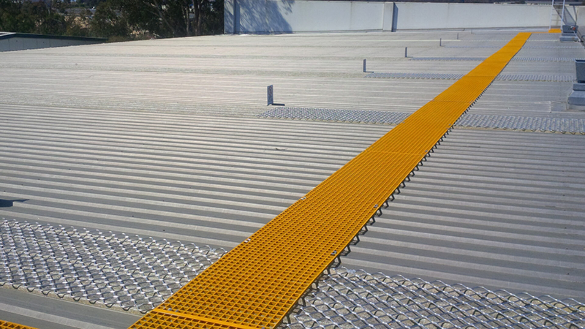 FRP walkway installed on a metal roof.