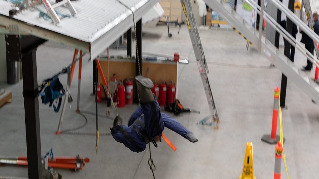 Dummy falling off a roof during a height safety demonstration.