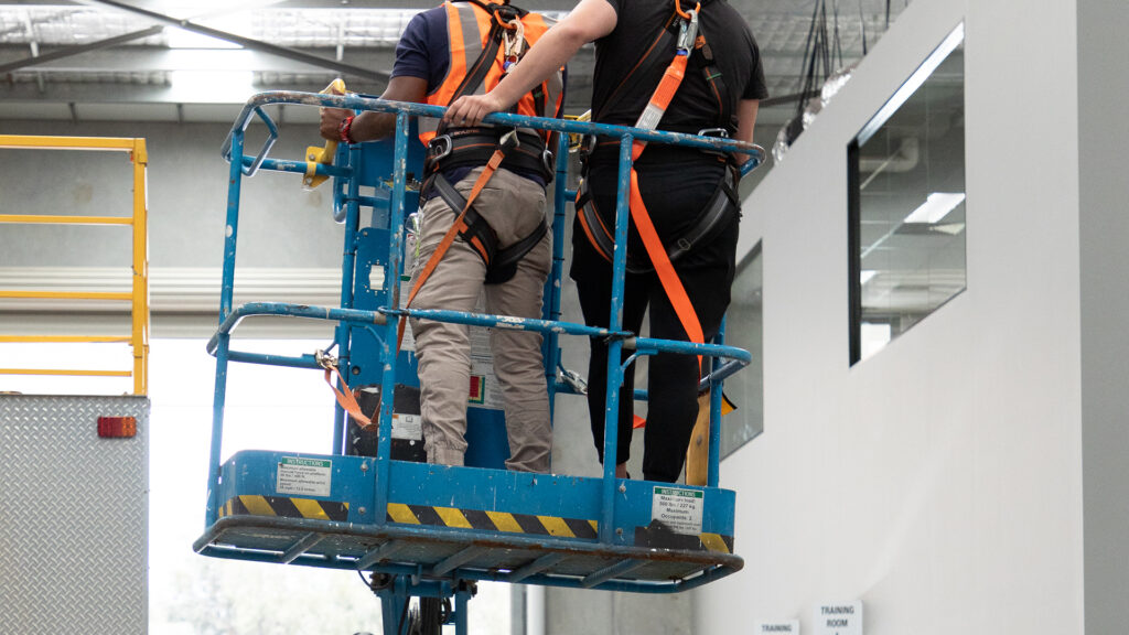 Participants moving an EWP through a training excercise at HSE Sydney.