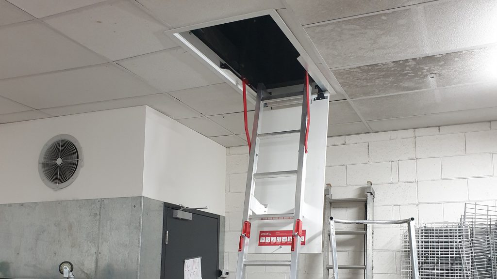 Closeable internal ladder for accessing roof space.