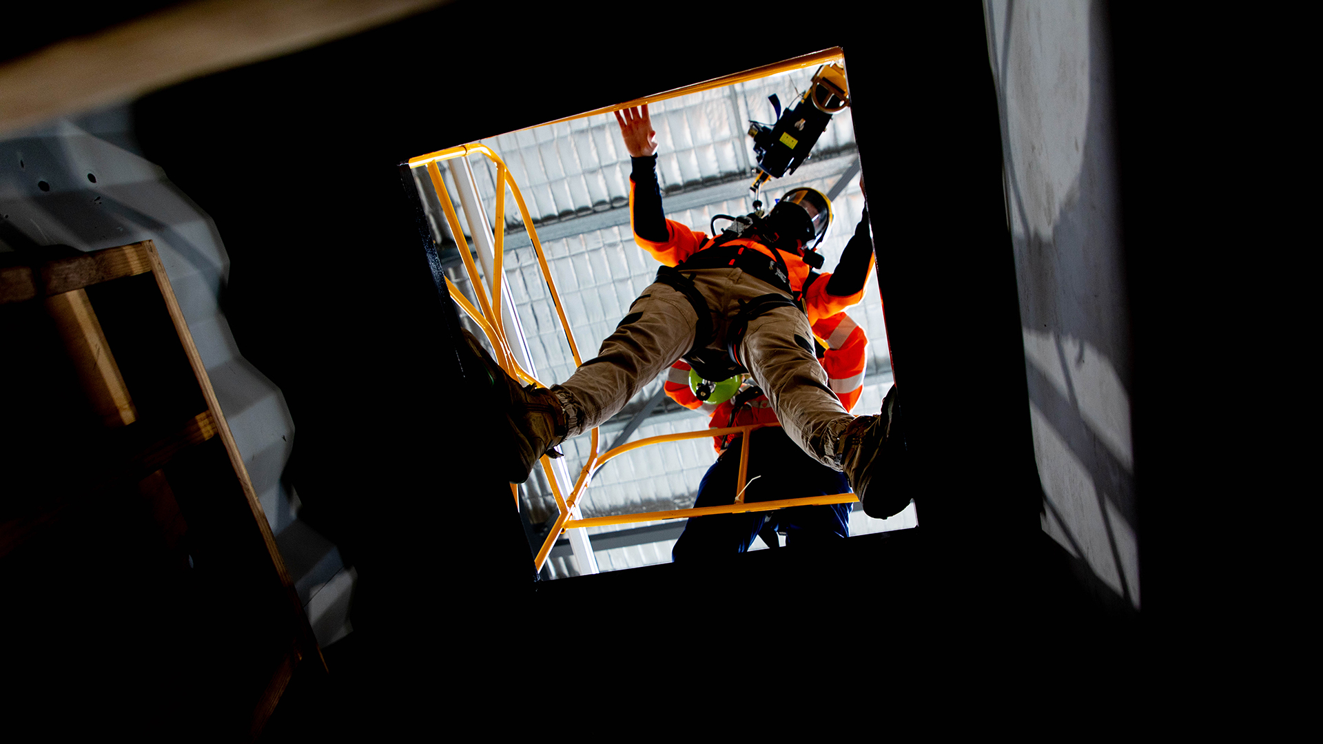 Participant wearing breathing apparatus entering a confined space.